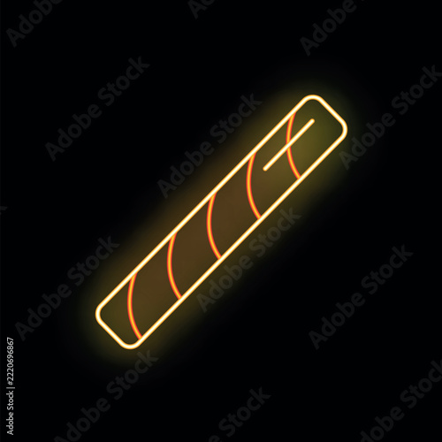 Wafer stick with chocolate filling glowing in vibrant neon colors on a black background
