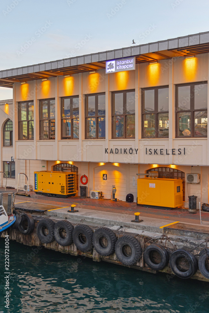 Fototapeta premium Lights On at Kadikoy Ferry Pier in Istanbul Turkey Dusk