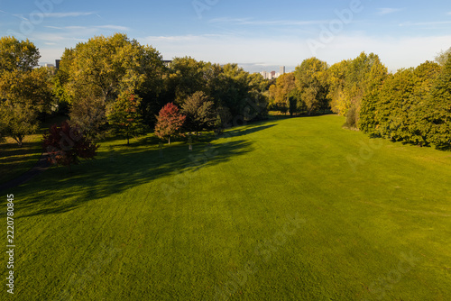 Philips Park Open Green Lawn and Autumn Foliage Morning Aerial View, East Manchester. 