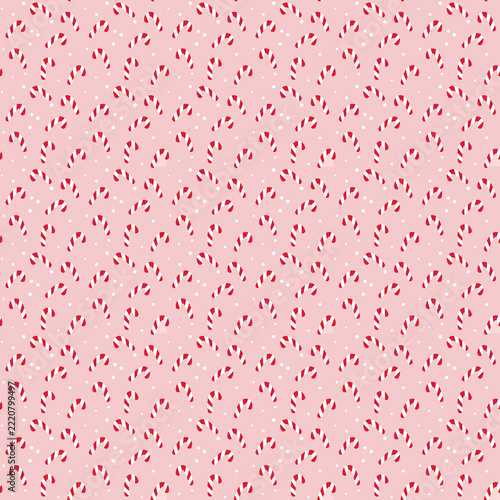 Christmas candy cane seamless pattern on pink background for festive