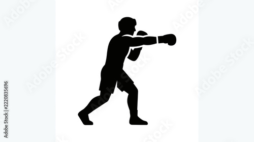 Silhouette of a boxer throwing a punch during a fight.