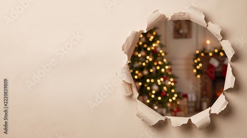 Christmas tree peek through torn paper hole, festive holiday background with glowing lights, winter celebration concept banner