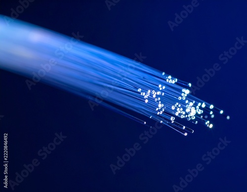 Blue Fiber Optic Cables Glowing with Data Transmission