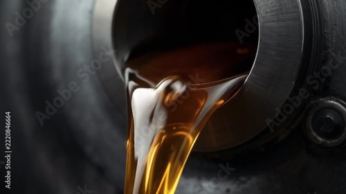 Motor oil is pouring from a canister