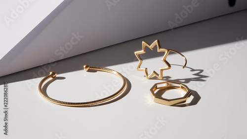 Gold jewelry set with star and geometric shapes bracelet