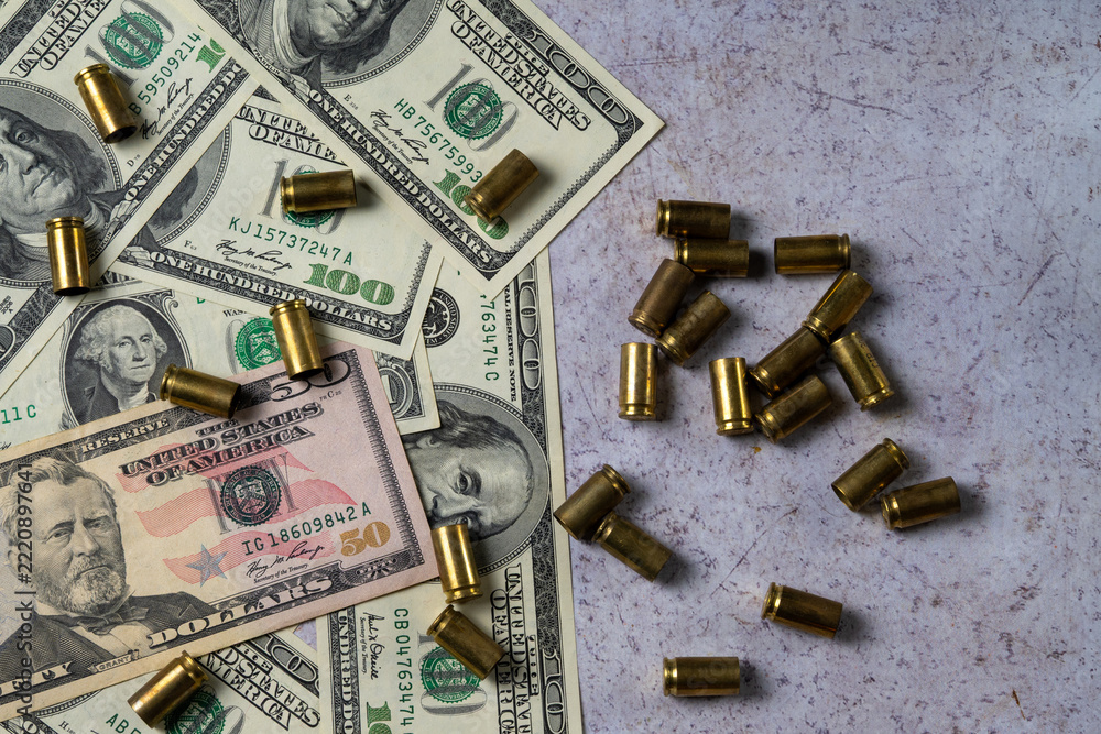 Fototapeta premium Money and Bullet Casings Symbolizing War Financing