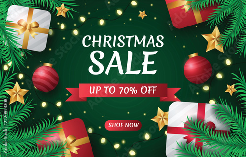 Christmas Sale banner with festive gift boxes, red ornaments, and glowing fairy lights on dark green background