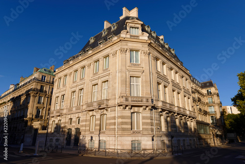 Grand corner stone building with mansard roof and dormer windows near Orsay museum , 7th district , Paris .