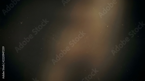 Cinematic dust overlay texture with floating particles and warm spotlight glow on dark background