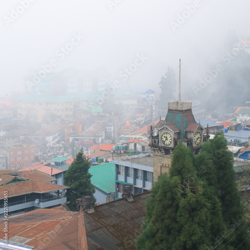 Historical clock tower in Darjeeling on a rainy day, India.