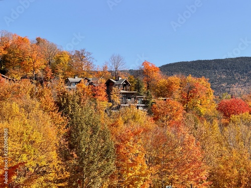 Lodge high in the mountains surrounded by the colors of fall foliage