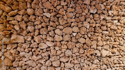 Natural stone wall texture made of volcanic coral rocks