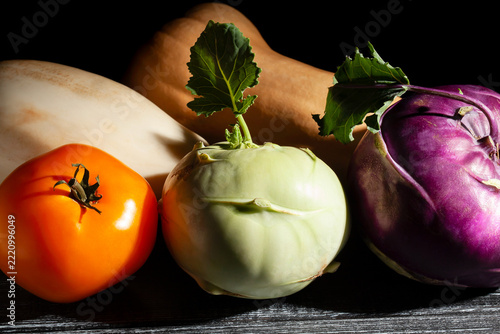 kohlrabi vegetable mix on black wood background