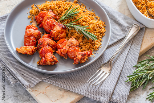 Spiced tomato and chicken skewers with mediterranean couscous