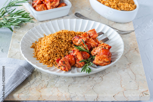 Spiced tomato and chicken skewers with mediterranean couscous