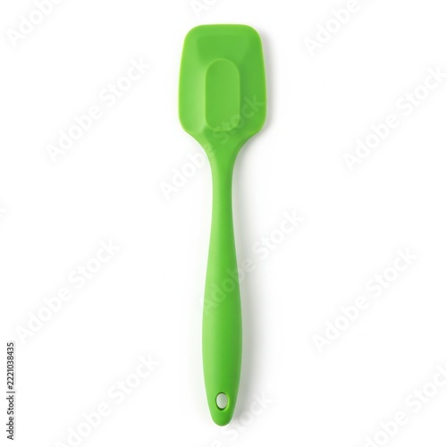 Bright green silicone baby spoon isolated
