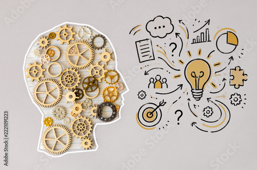 Fotografie Creative Thinking and Innovation Concept with Human Head Silhouette, Mechanical Gears and Hand Drawn Business Idea Doodles