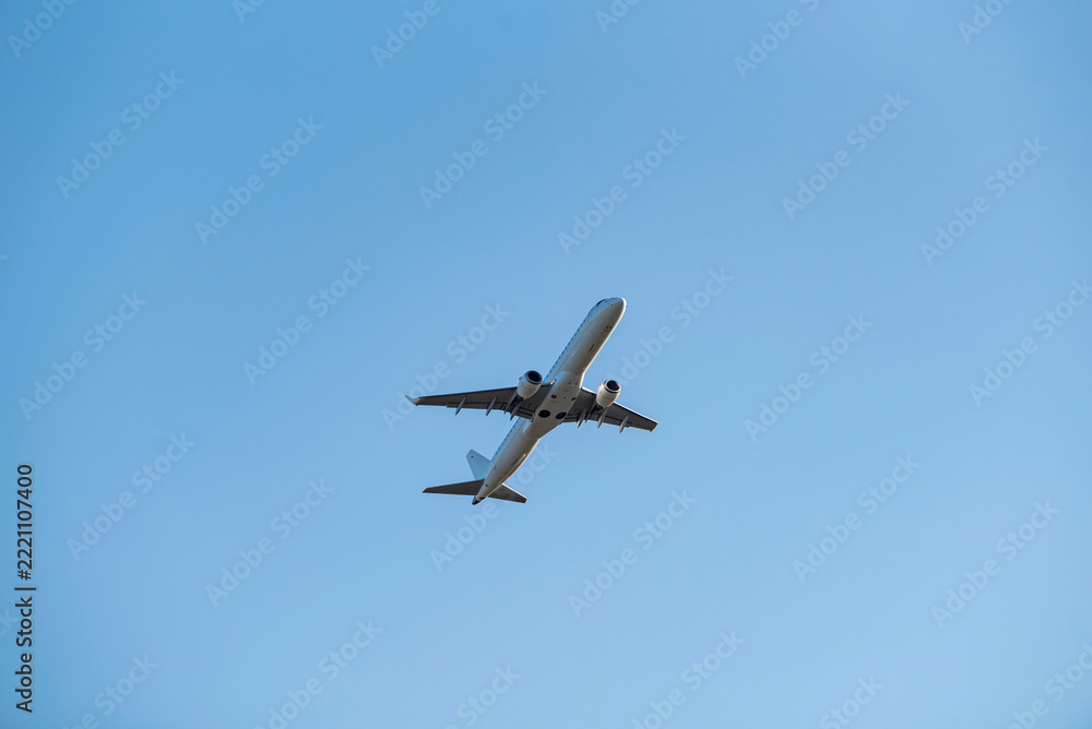 Fototapeta premium Big white passenger plane in blue sky