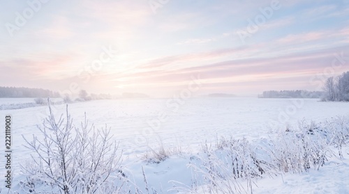 Pastel winter sky over a snowy field