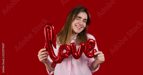 St Valentines copy space banner. Woman with love sign balloon