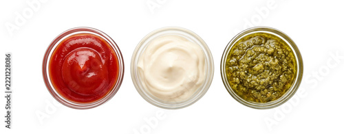 Three glass bowls filled with ketchup mayonnaise and pesto sauce in white background condiment culinary prepared collection assortment arrangement top view