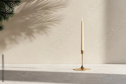 Single candle stands tall on minimalist surface. Soft shadow from leaf casts gentle contrast. Warm tone complements calm, serene atmosphere. Ideal for quiet moments or modern interior design