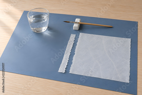 Water brush and torn tissue prepared for paper repair