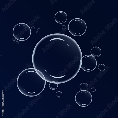 A stunning collection of iridescent soap bubbles floating against a dark navy blue backdrop