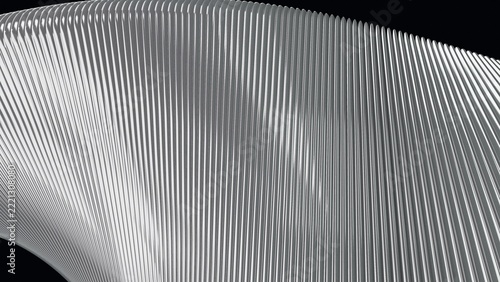 Close-up of silver ribbed metal surface arching over black edges