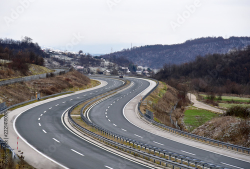 Two lanes of a modern highway. Highway curve.