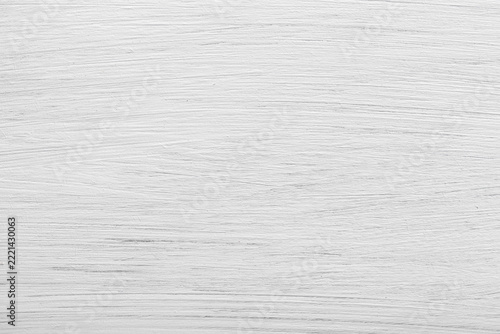 White-painted wooden board with visible wood grain and texture