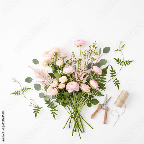 Delicate pink flower bouquet being artfully arranged