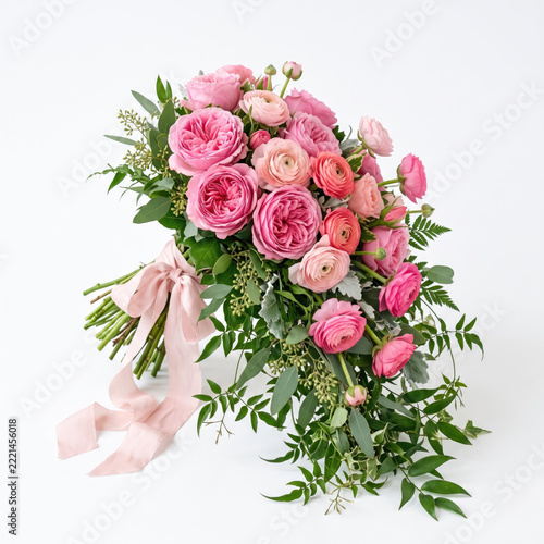 Romantic pink wedding flower bouquet with elegant ribbon