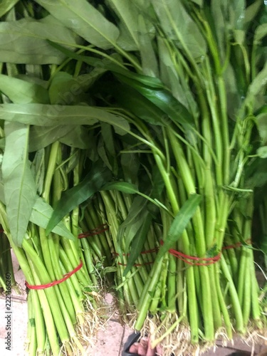 Pile of fresh water morning glory or water spinach or kangkung sell at traditional market	
