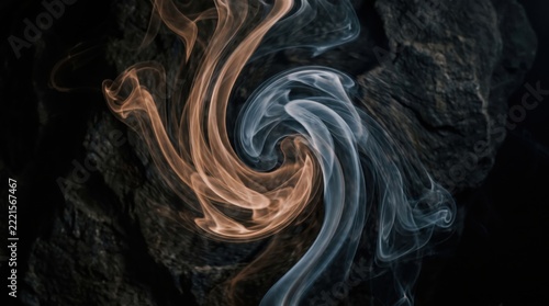 Abstract smoke swirl on dark background with warm cool tones