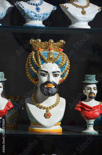 Caltagirone, Sicily 01.03.2020: Male *Testa di Moro* (Moor's Head) displayed in the window of an artisan workshop in Caltagirone.