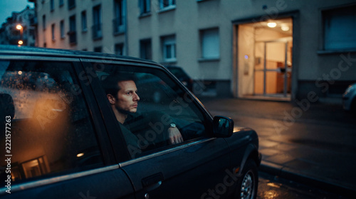 Man Driving Away Alone on a Dark Road
