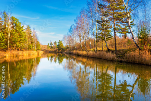 A colorful autumn river with reflections