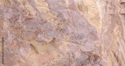 Abstract Weathered Sandstone Rock Texture with Pink Beige and Rust Colored Mineral Patterns