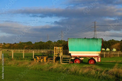 Autumnal dawn glow on gypsy caravan.