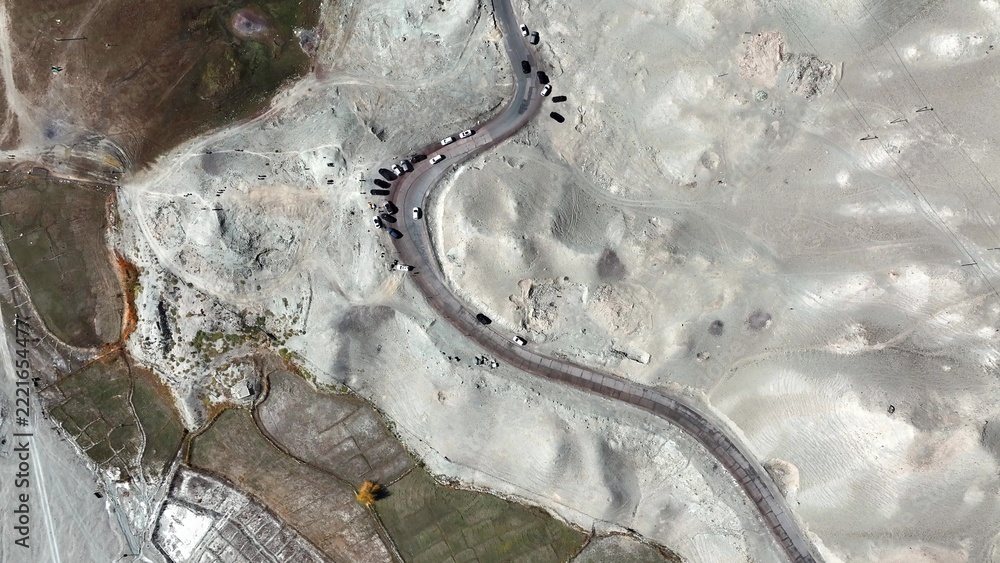 Fototapeta premium winding mountain road on pamir plateau aerial view