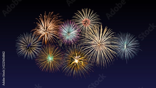Fireworks of various colors and shapes burst in night sky