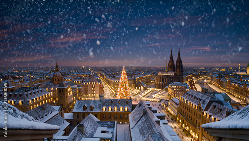 An elevated panorama shows snowy rooftops and church