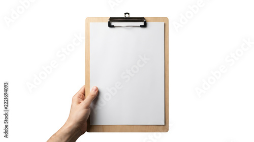 A human hand holding a vertical light brown wooden clipboard featuring a metal clamp at the top holding a clean blank white sheet of paper, presented upright against a solid isolated background