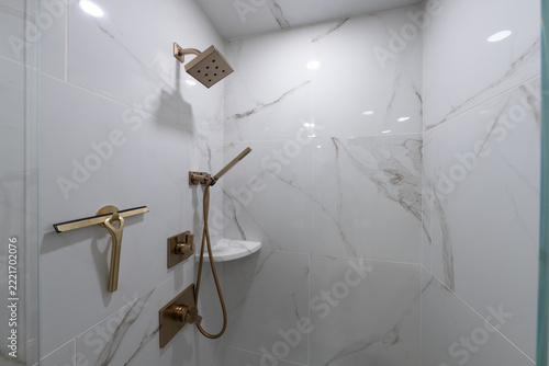 Bathroom shower has been updated with new ceramic tile and fixtures