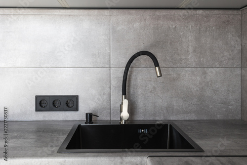 kitchen faucet on a stylish metal sink