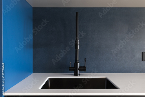 kitchen faucet on a stylish metal sink