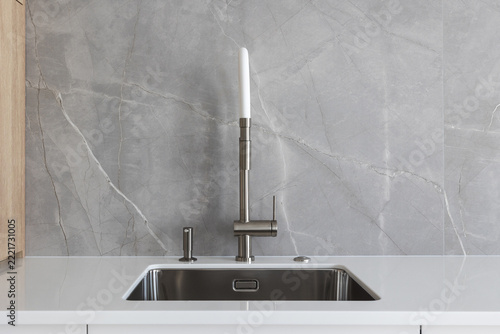 kitchen faucet on a stylish metal sink
