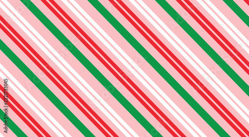 Abstract diagonal striped pattern featuring repeating red white green and pink lines for holiday backgrounds