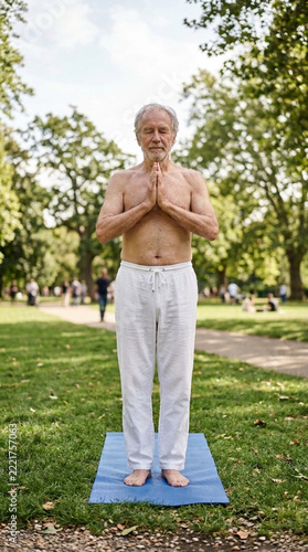 Elderly Man Practicing Yoga in Park Namaste Pose Peaceful Outdoor Activity